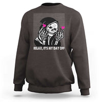 Dark brown crewneck sweatshirt with grim reaper graphic and “Relax, It’s My Day Off” text