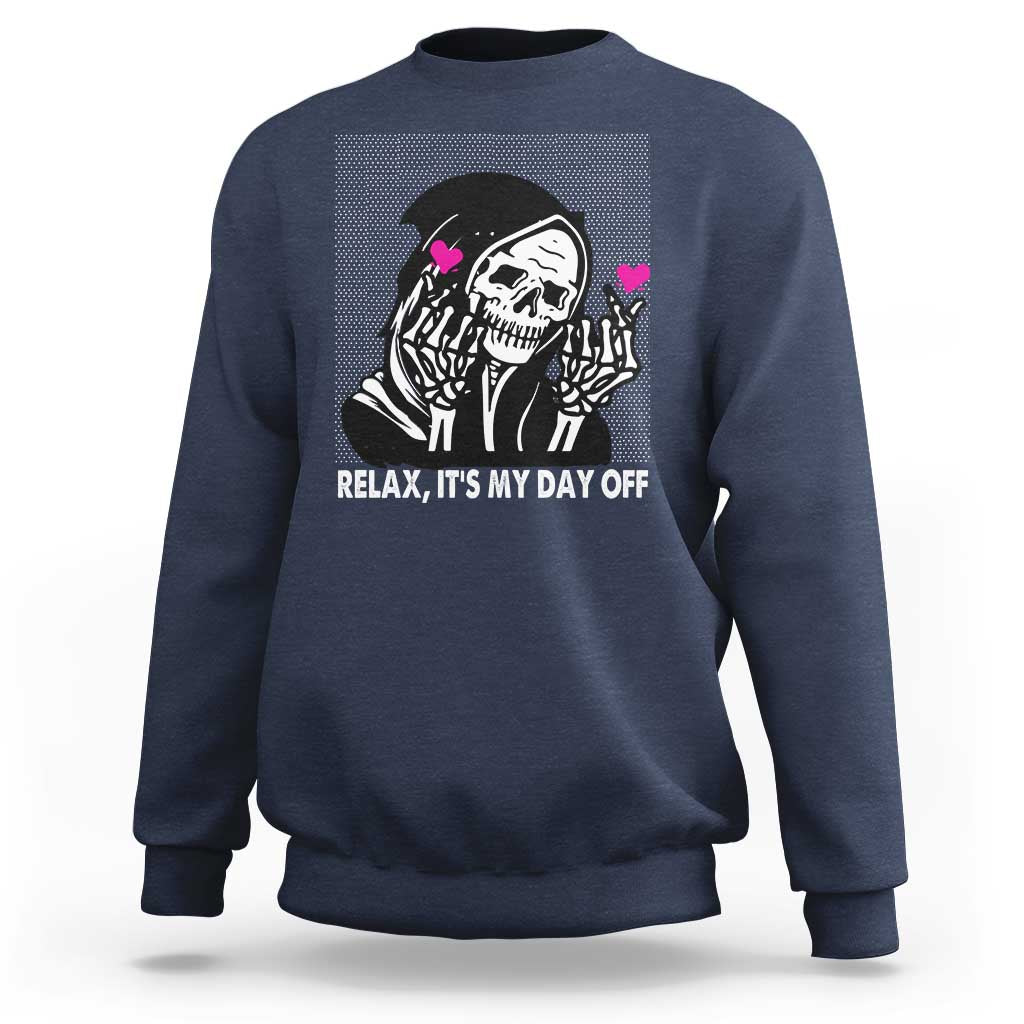 Navy crewneck sweatshirt with grim reaper graphic and “Relax, It’s My Day Off” text