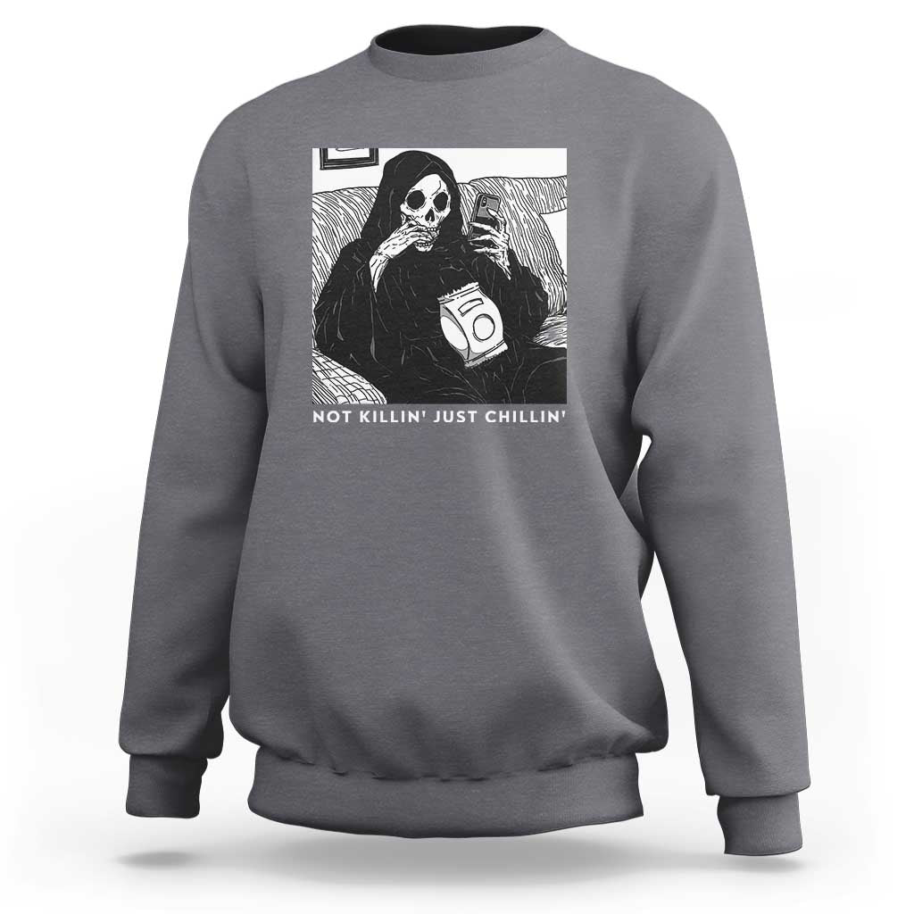 Charcoal crewneck sweatshirt with grim reaper graphic and chilling slogan text