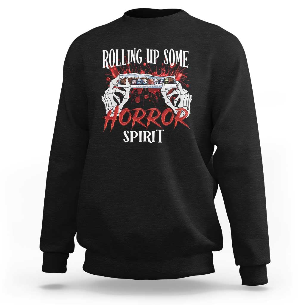 Black Halloween sweatshirt with front graphic reading “Rolling Up Some Horror Spirit”