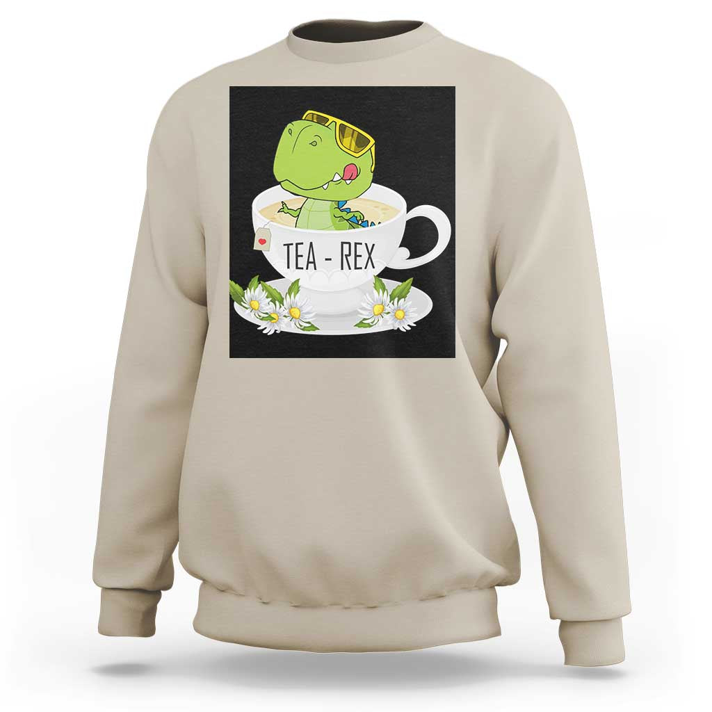 Sand beige crewneck sweatshirt with green dinosaur tea graphic on front