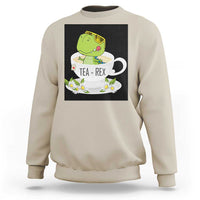 Sand beige crewneck sweatshirt with green dinosaur tea graphic on front