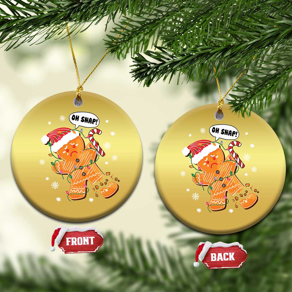 Gold circular gingerbread snap ornament pair on tree branches, front and back views