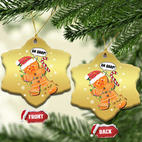 Gold snowflake-shaped gingerbread snap ornaments with “Oh Snap!” front and back views
