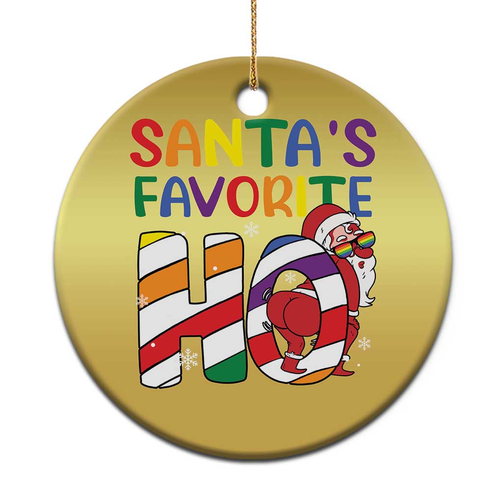Gold round Christmas ornament with “Santa’s Favorite” text and cartoon Santa holding a rainbow