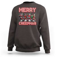 Charcoal crewneck sweatshirt with “MERRY” and “CREEPMAS” graphic and horror characters