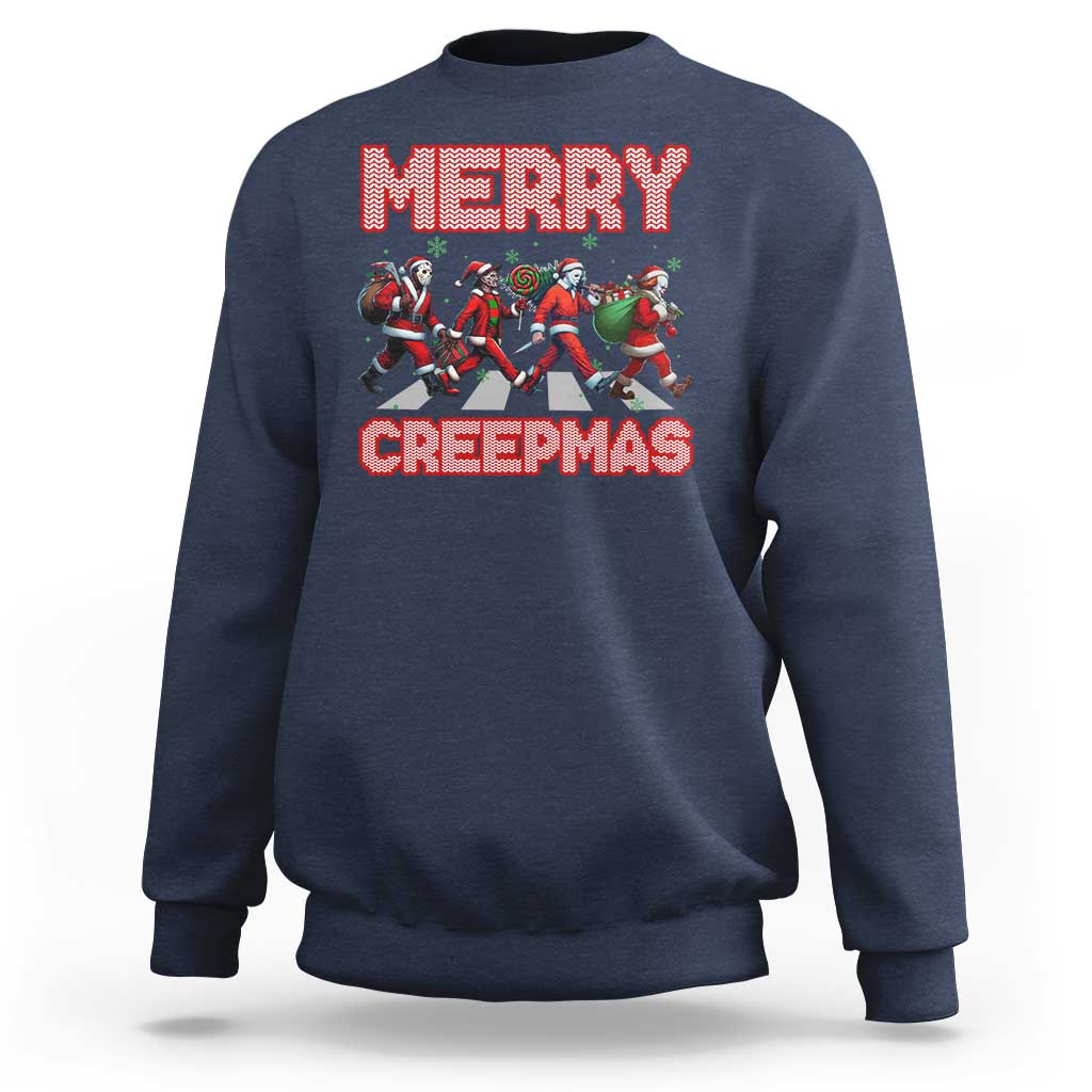 Navy crewneck sweatshirt with “MERRY” and “CREEPMAS” graphic and horror characters