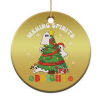 Gold round Christmas ornament with cute ghost and Christmas tree graphic, hanging loop
