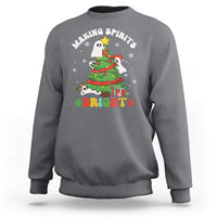 Gray crewneck sweatshirt with cute ghost Christmas tree graphic and “Bright” text.