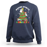 Navy crewneck sweatshirt with cute ghost Christmas tree graphic and “Bright” text.