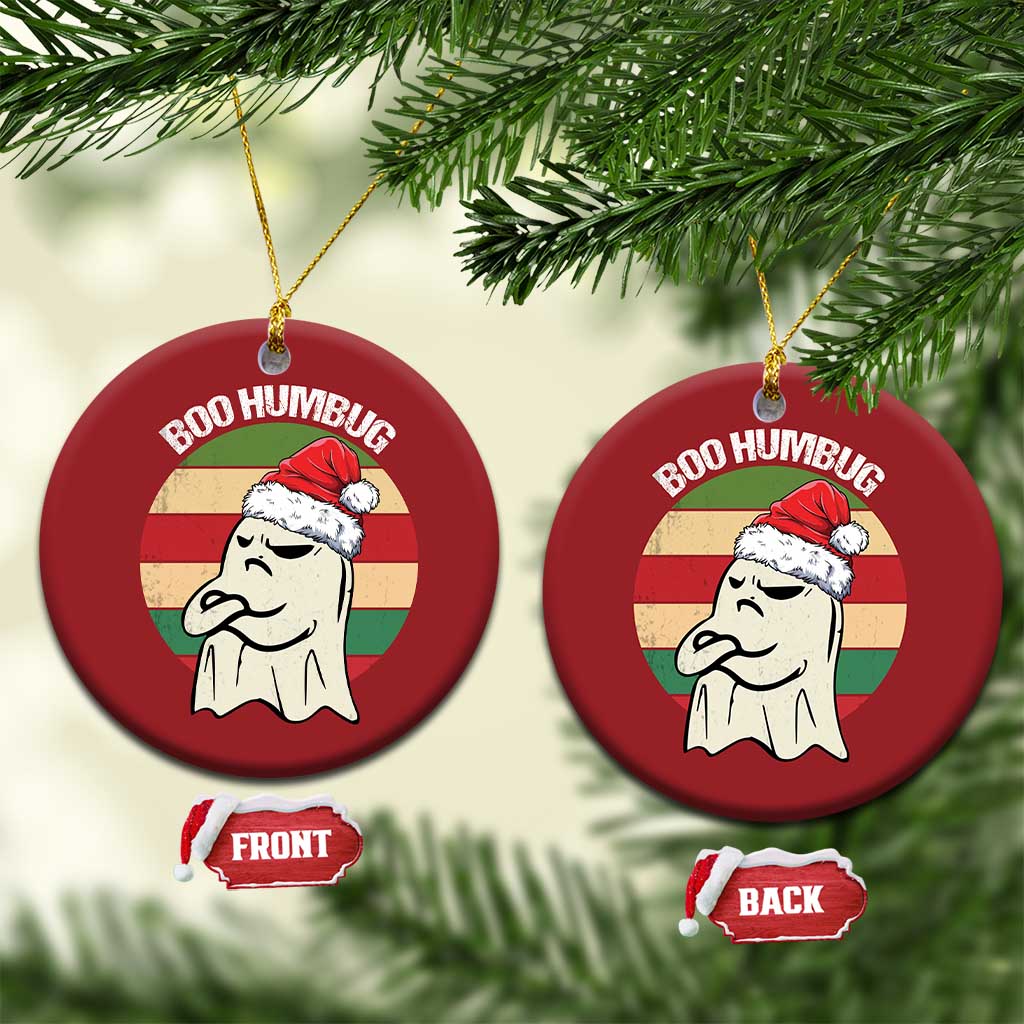 Red round “BOO HUMBUG” ghost ornament hanging on gold strings