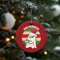 Red round “BOO HUMBUG” ghost ornament on a gold string