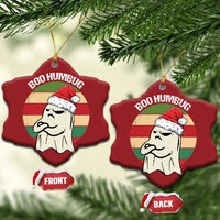 Red bell-shaped ornaments with ghost in a Santa hat and “BOO HUMBUG”