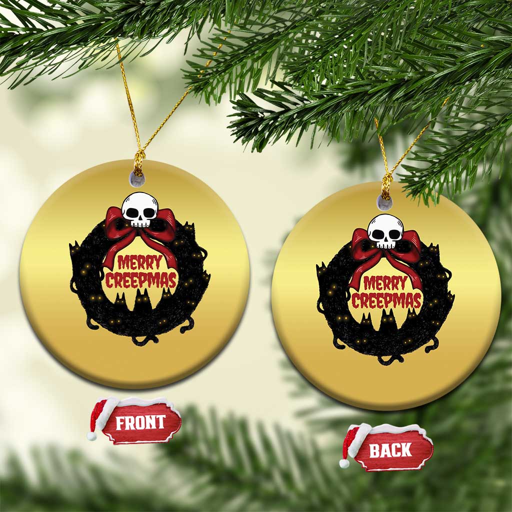 Gold round cat-wreath ornament pair on tree branches, skull “Merry Creepmass” front/back