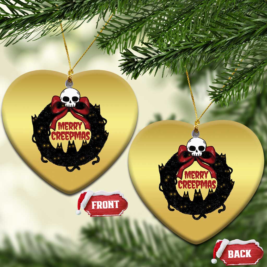 Gold heart-shaped cat-wreath ornaments with skull and “Merry Creepmass” text