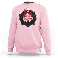Light pink gothic Christmas sweatshirt with cat wreath skull graphic and “MERRY CREEPmas” text