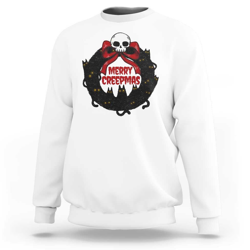 White gothic Christmas sweatshirt with cat wreath skull graphic and “MERRY CREEPmas” text
