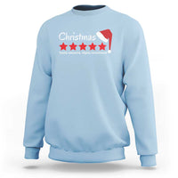 Light blue Christmas sweatshirt with white Santa hat graphic and star text on chest