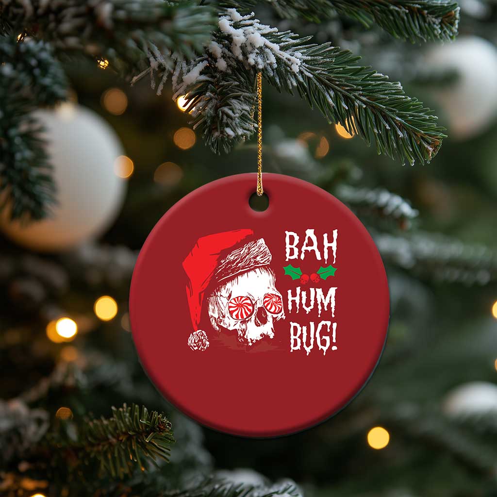 Red round hanging Christmas ornament with skull Santa graphic and 'BAH HUM BUG!' text, gold loop