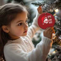 Red round Christmas ornament with skull Santa face and 'BAH HUM BUG!' text, gold hanging loop
