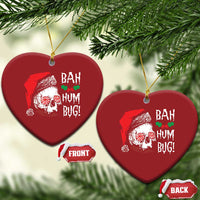 Red heart-shaped Christmas ornament with skull Santa graphic and 'BAH HUM BUG!' text, gold loop
