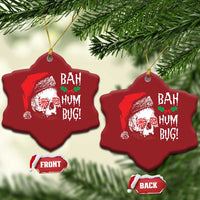 Two red heart-shaped Christmas ornaments with skull Santa graphic and 'BAH HUM BUG!' text, gold loops