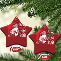 Red star-shaped Christmas ornament with skull Santa graphic and 'BAH HUM BUG!' text, gold loop