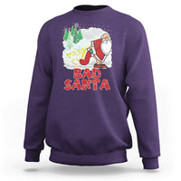 Purple crewneck Christmas sweatshirt with 'Bad Santa' graphic