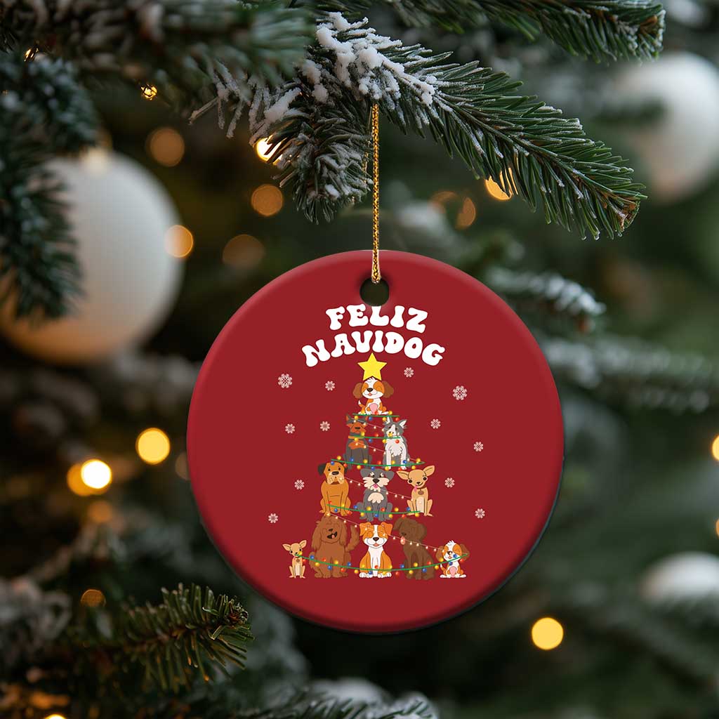 Red round Feliz Navidog dog Christmas ornament with gold hanging loop and festive dog scene