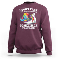 Maroon crewneck sweatshirt with colorful unicorn graphic and funny slogan print