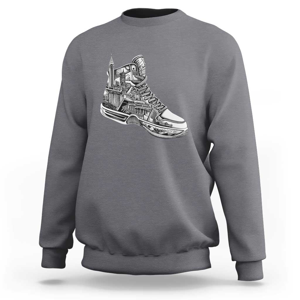 Charcoal gray crewneck sweatshirt with white sneaker graphic on the chest