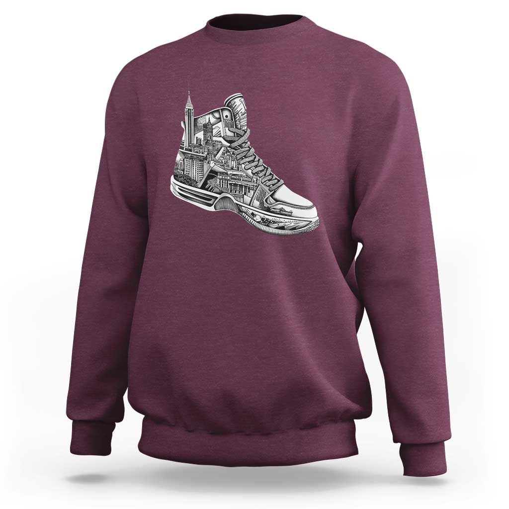 Maroon crewneck sweatshirt with white sneaker graphic on the chest