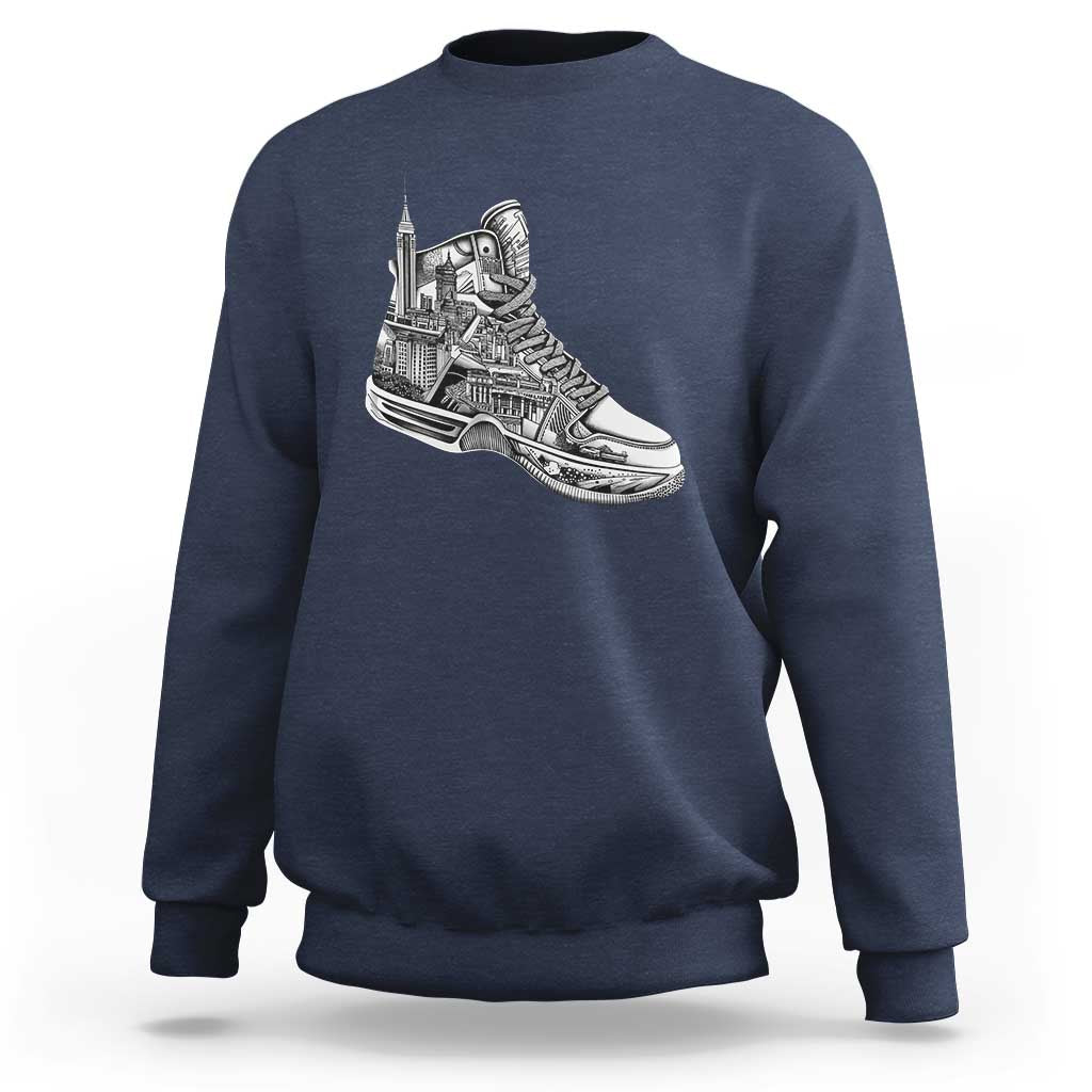 Navy crewneck sweatshirt with white sneaker graphic on the chest