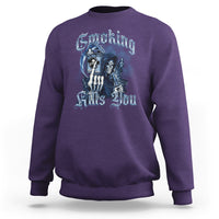 Purple crewneck sweatshirt with blue skeleton smoking graphic on front