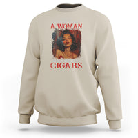 Sand beige women's crewneck sweatshirt with back graphic of woman smoking cigars