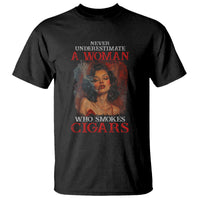 Black graphic t-shirt with cigar slogan 'A WOMAN' and 'WHO SMOKES CIGARS' print