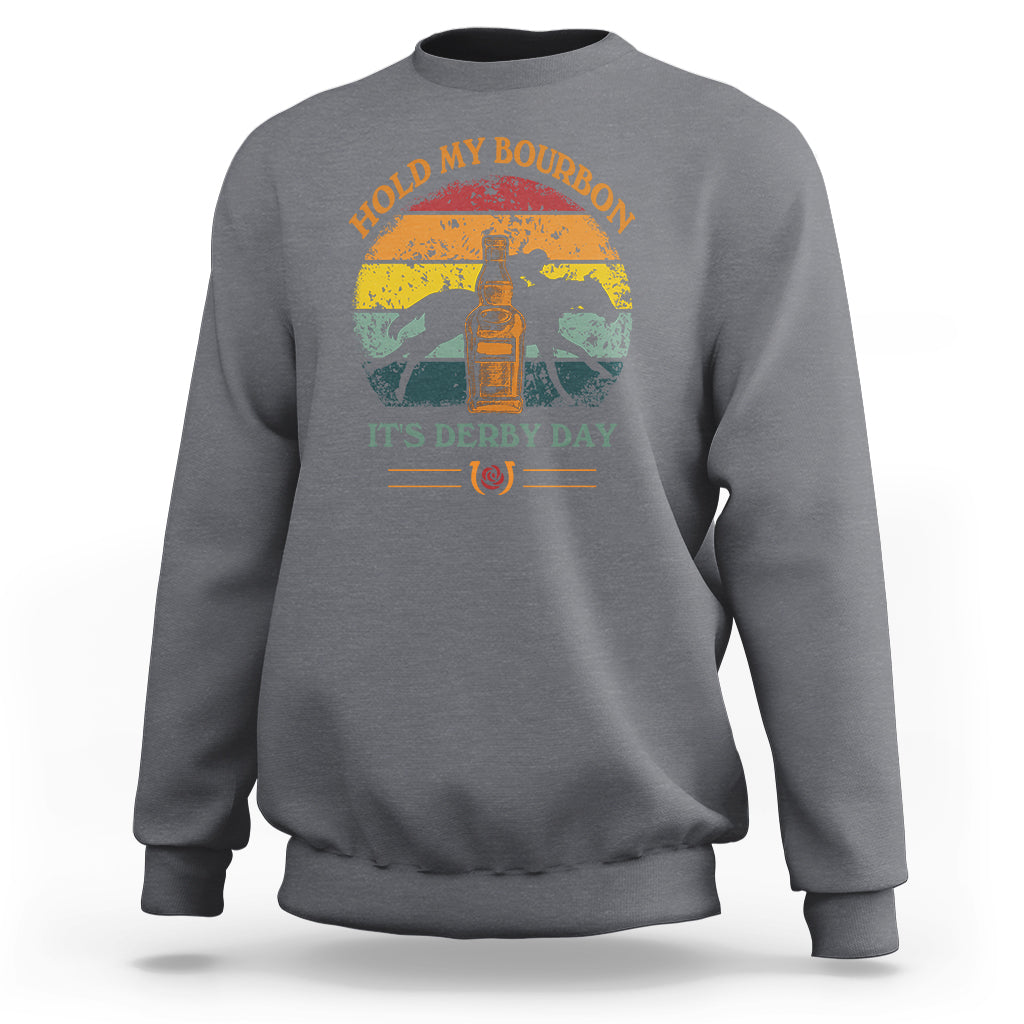 Charcoal sweatshirt with horse-and-bourbon graphic and “It’s Derby Day” text on front.