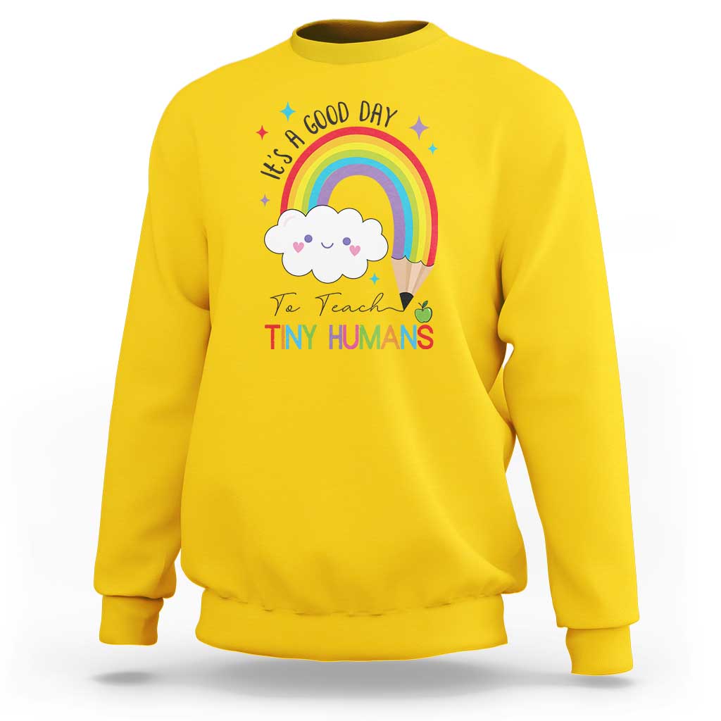 Pre-school teacher sweatshirt in daisy yellow with rainbow and “Tiny Humans” graphic