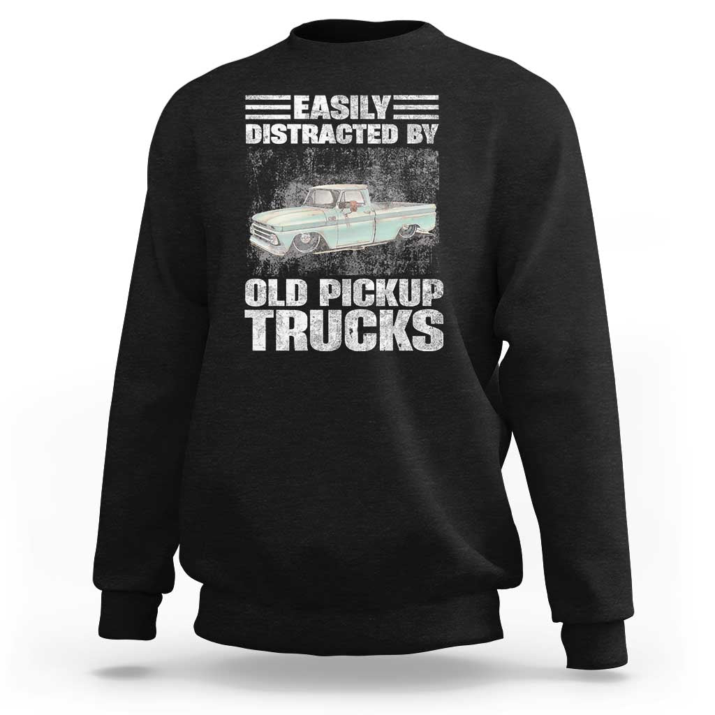 Black truck driver sweatshirt with “Easily distracted by old pickup trucks” graphic