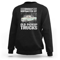 Black truck driver sweatshirt with “Easily distracted by old pickup trucks” graphic