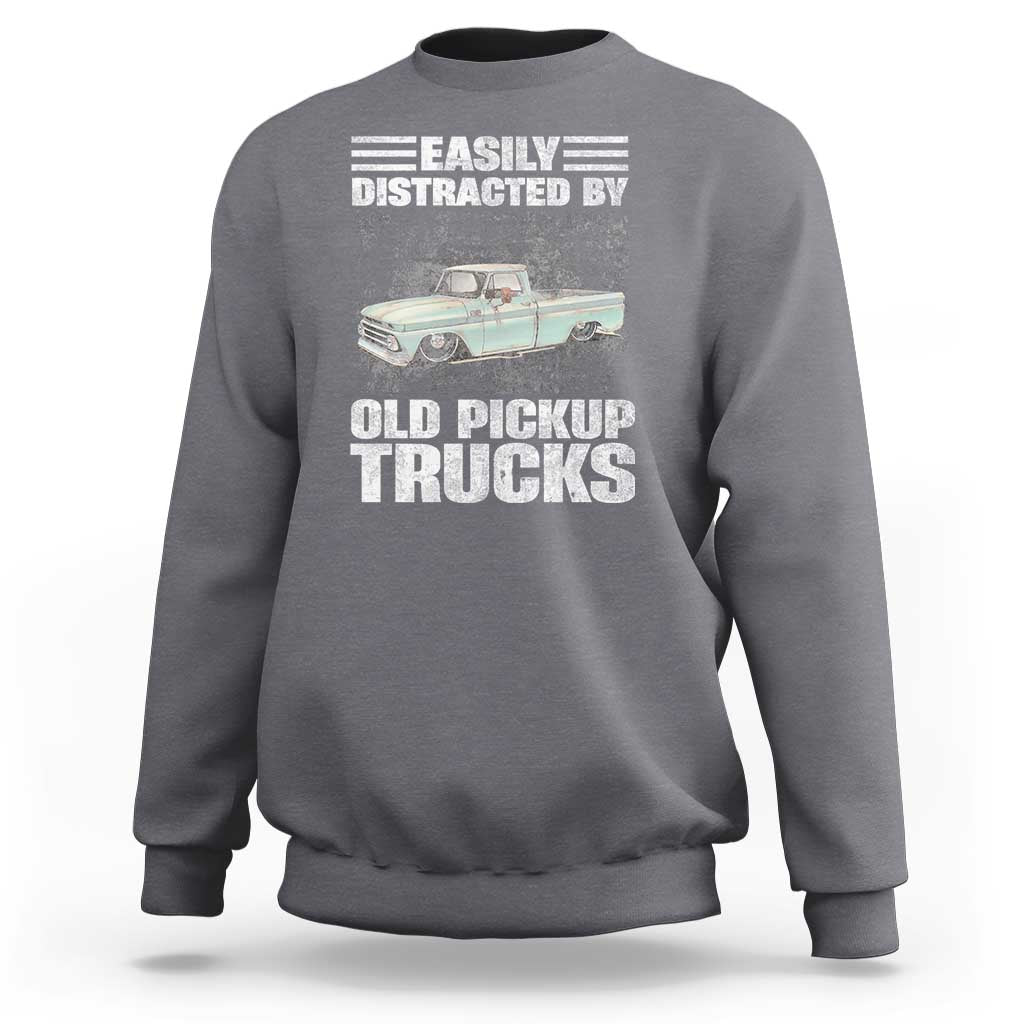 Charcoal truck driver sweatshirt with “Easily distracted by old pickup trucks” graphic