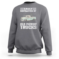 Charcoal truck driver sweatshirt with “Easily distracted by old pickup trucks” graphic