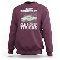 Maroon truck driver sweatshirt with “Easily distracted by old pickup trucks” graphic