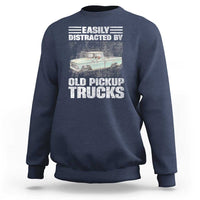 Navy truck driver sweatshirt with “Easily distracted by old pickup trucks” graphic