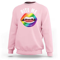 Light pink crewneck sweatshirt with 'BITE ME' lip graphic front, long sleeves.