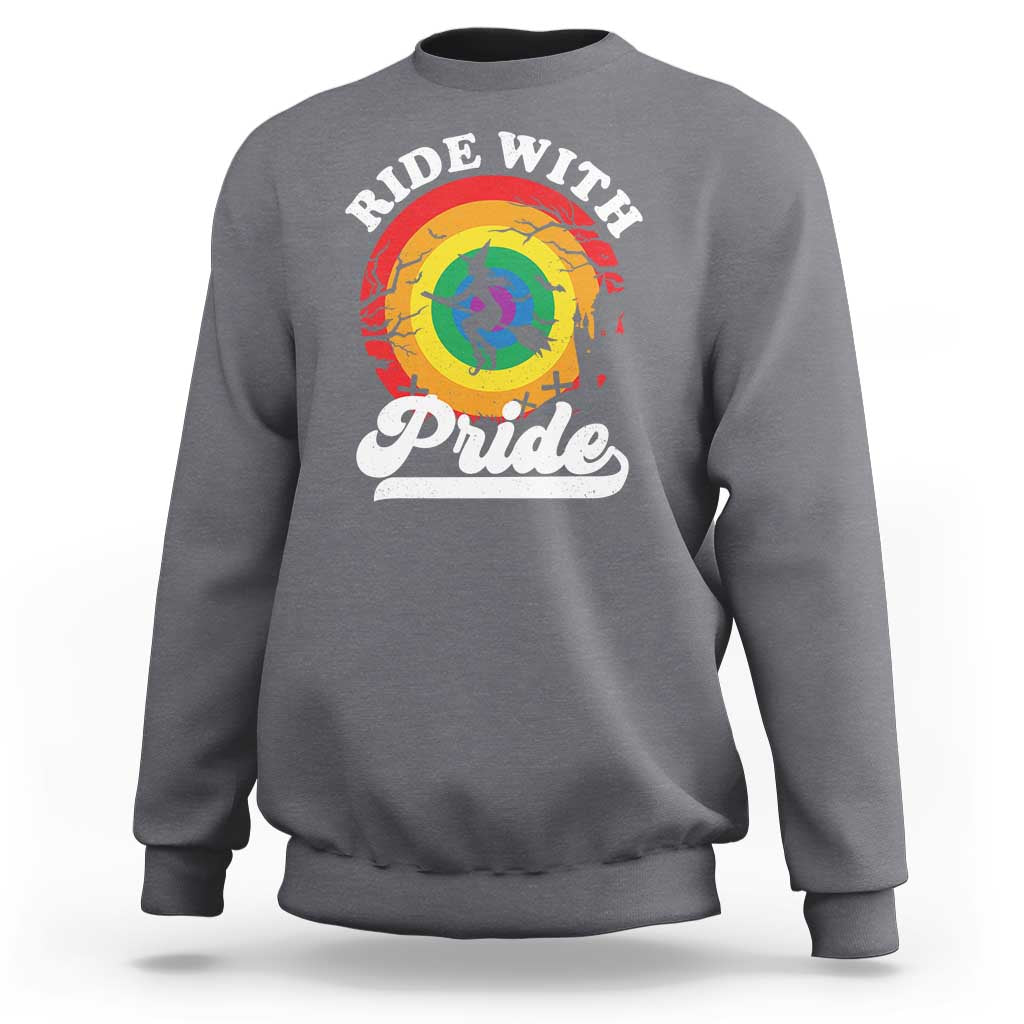 Charcoal crewneck sweatshirt with Ride With Pride rainbow witch and Pride graphic