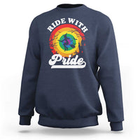 Navy crewneck sweatshirt with Ride With Pride rainbow witch and Pride graphic
