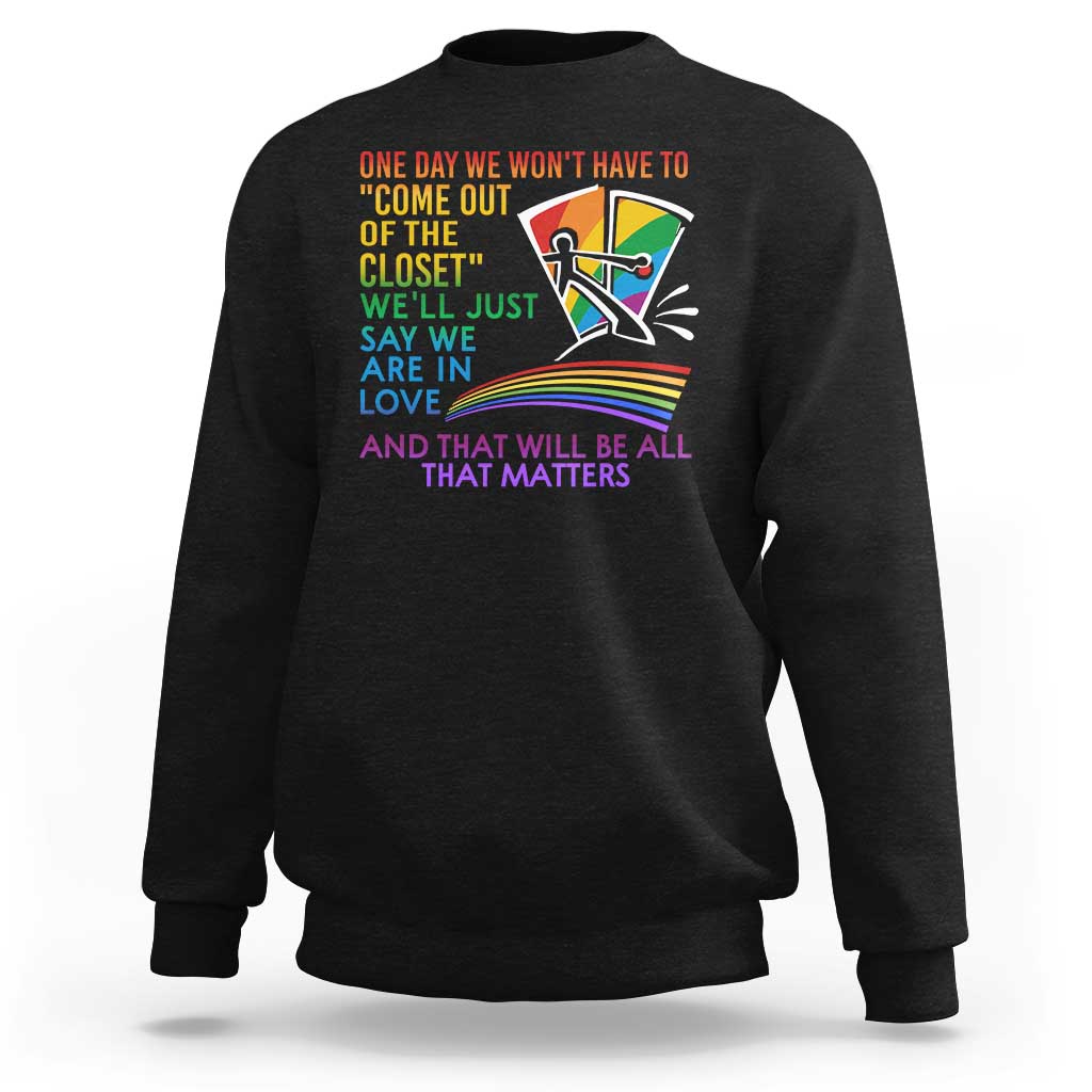 Black sweatshirt with rainbow pride graphic and multicolor slogan on front