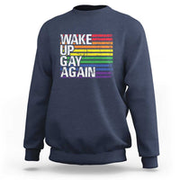 Navy crewneck sweatshirt with rainbow "Wake Up Gay Again" graphic on front