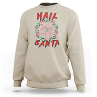 Sand crewneck sweatshirt with centered “Hail Santa” festive graphic